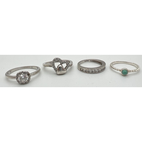 1018 - 4 modern design stone set silver dress rings. A twist style band with bezel set small round turquois... 