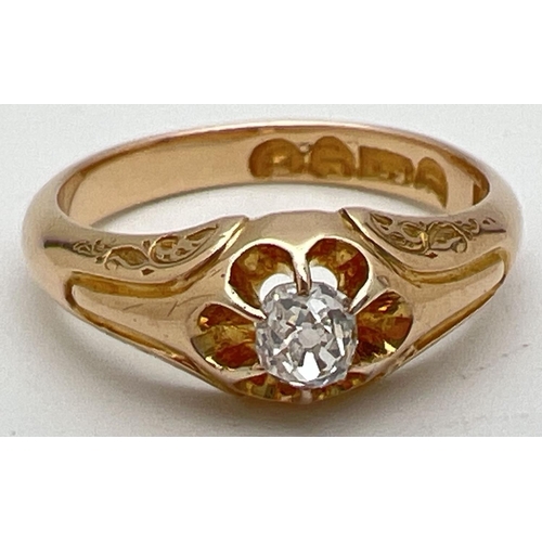 1003 - An Victorian style 15ct gold claw set single diamond dress ring. Floral detail to shoulders. Approx.... 