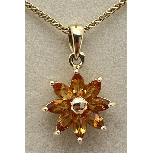 1030 - A 9ct gold flower design pendant set with 8 marquise cut citrine stones. On an 18