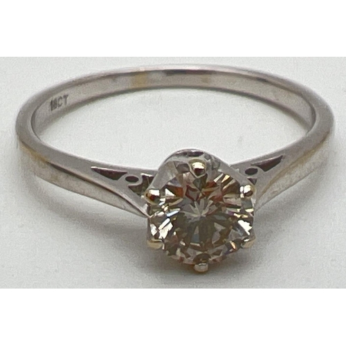 1047 - An 18ct white gold .50ct diamond solitaire ring. Ring size N. Gold marks to inside of band. Total we... 