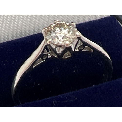 1047 - An 18ct white gold .50ct diamond solitaire ring. Ring size N. Gold marks to inside of band. Total we... 