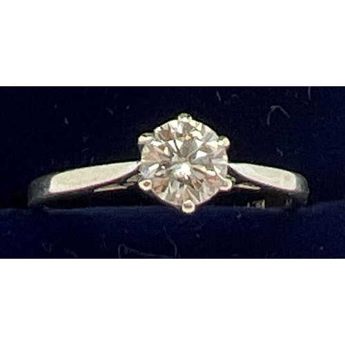 1047 - An 18ct white gold .50ct diamond solitaire ring. Ring size N. Gold marks to inside of band. Total we... 