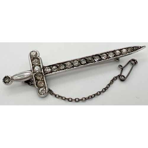 1054 - A vintage silver stone set brooch modelled as a sword, complete with safety chain. Set with 20 round... 