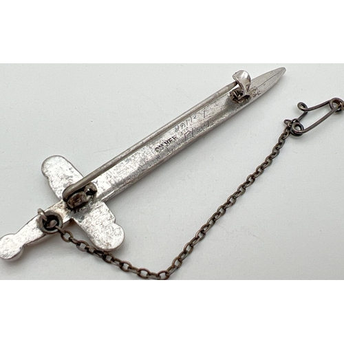 1054 - A vintage silver stone set brooch modelled as a sword, complete with safety chain. Set with 20 round... 