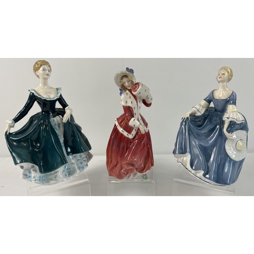 1205 - 3 Royal Doulton ceramic figurines. Hilary - HN2335 in blue dress with star shaped detail; Janine - H... 