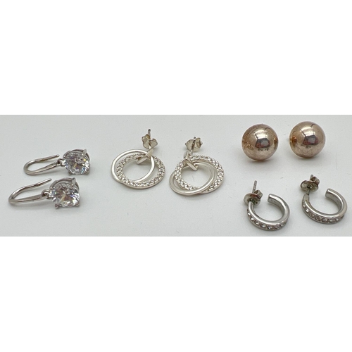 1067 - 4 pairs of silver and white metal earrings, some stone set. A Pair of domed silver studs, a pair of ... 