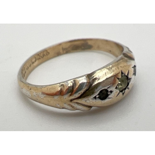 1068 - A antique 9ct gold on silver gypsy style ring set with 3 clear stones. Gold marks to inside of band.... 