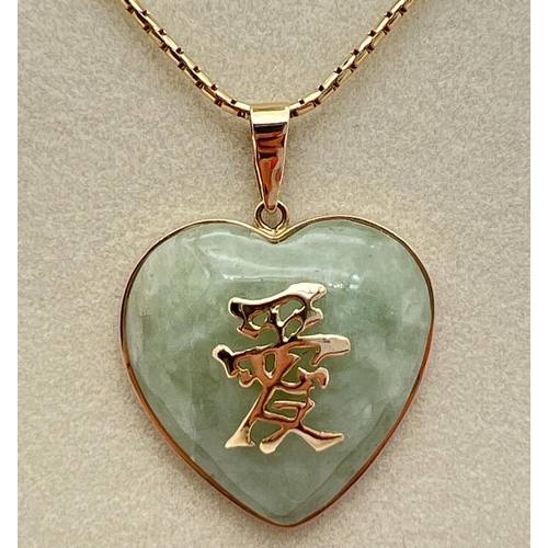 1069 - A 9ct gold heart shaped pendant set with pale green jade, with 9ct gold Chinese characters to front.... 