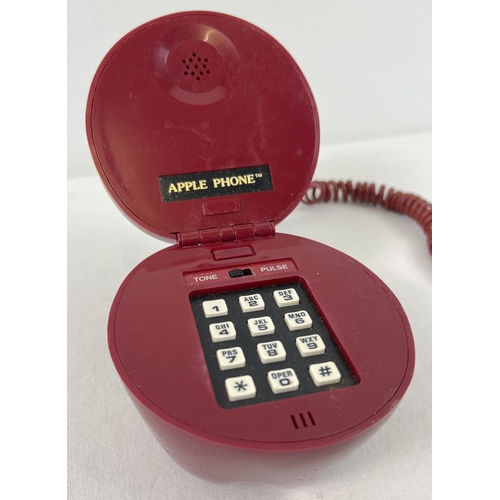 1308 - A vintage 1980's novelty wired landline telephone 'Apple Phone' with push buttons.