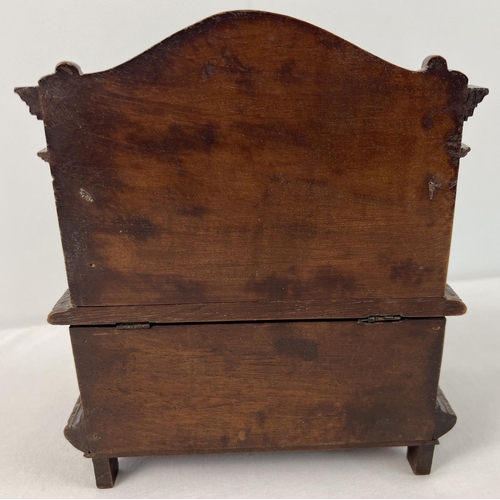 1309 - A late Victorian sewing box modelled as a highly carved monks bench with claw feet. With ornately ca... 