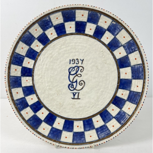 1219 - A Crown Ducal George VI Coronation ware charger by Charlotte Rhead. Blue and white checkerboard patt... 