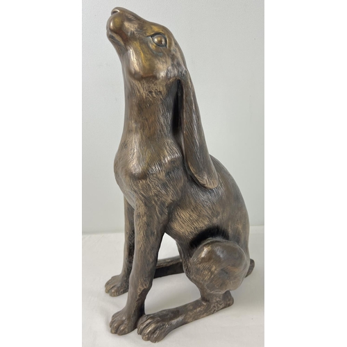 1311 - A large bronze effect resin figure of 