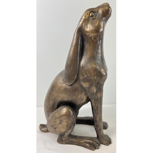 1311 - A large bronze effect resin figure of 