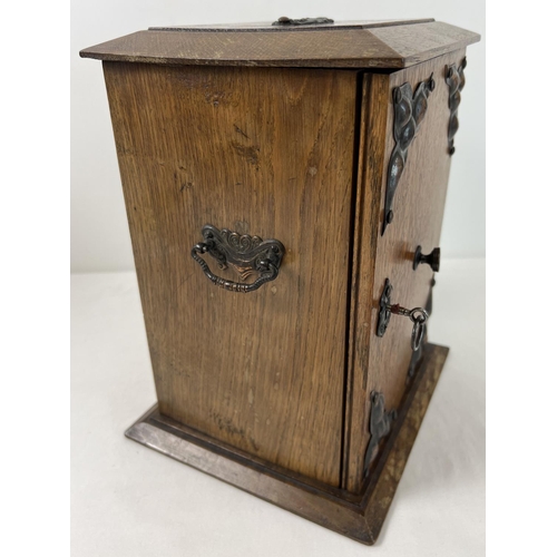 1313 - An early 20th century oak smokers cabinet with Arts & Crafts style copper panels applied to door. 2 ... 