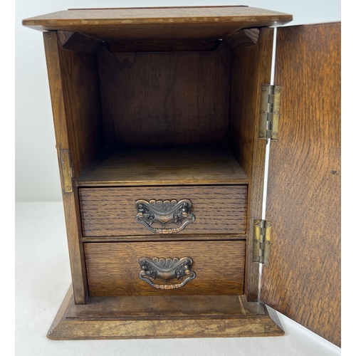 1313 - An early 20th century oak smokers cabinet with Arts & Crafts style copper panels applied to door. 2 ... 