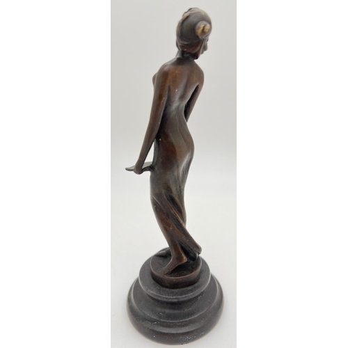 1138 - A small bronze figure of an Art Nouveau style nude, on a circular marble plinth. Approx. 19cm tall.