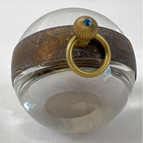 1200 - A top winding glass ball watch, bound in brass with roman numeral markers. Approx. 6cm diameter. In ... 