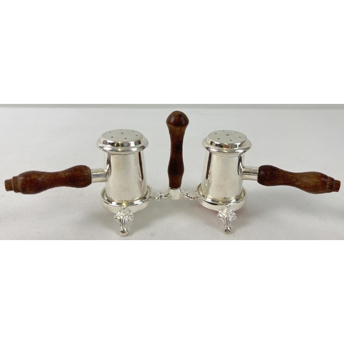 1108 - A decorative silver plated 3 piece cruet with turned wooden handles. Approx. 7.5cm tall.