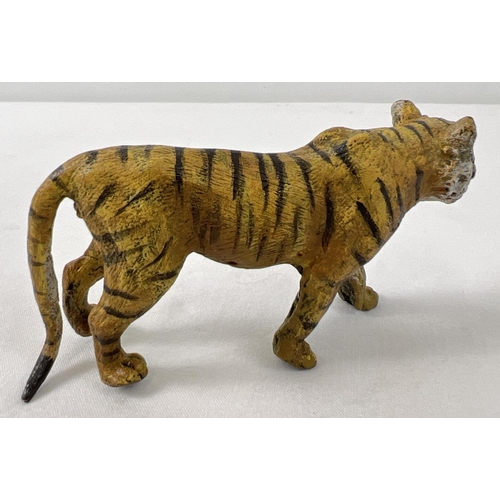 1140 - A small cold painted bronze figure of a tiger - after Bergman.  Approx. 5.5cm tall x 11cm long.