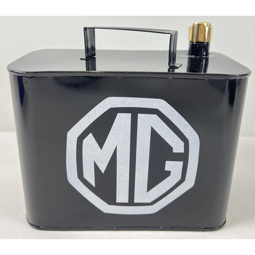 1290 - A small black metal MG petrol can with brass screw top lid. Approx. 18.5cm tall.