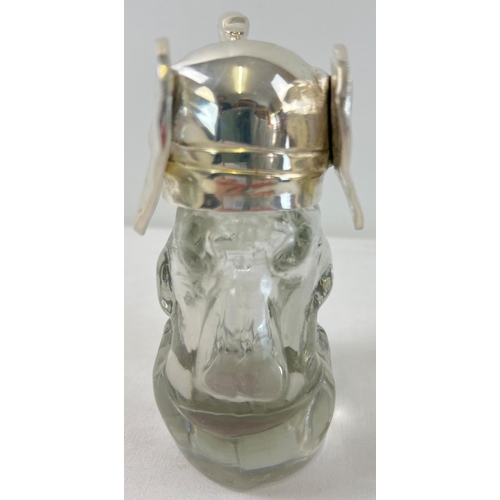 1110 - A clear glass bottle/decanter modelled as an elephant with a silver plated lid and rim. With brown g... 