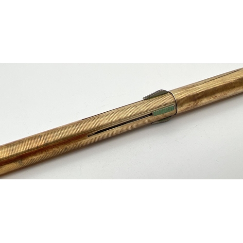 1132 - A vintage gold plated on silver Super-Norma Mecan multi coloured propelling pencil. Engine turned de... 