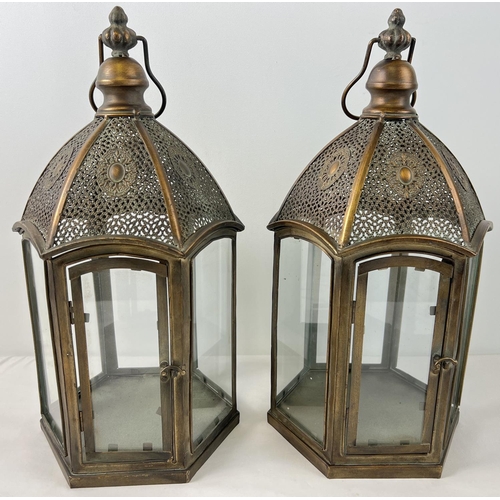 1316 - A large pair of Eastern style bronzed effect metal and glass panelled hexagonal lanterns with hinged... 