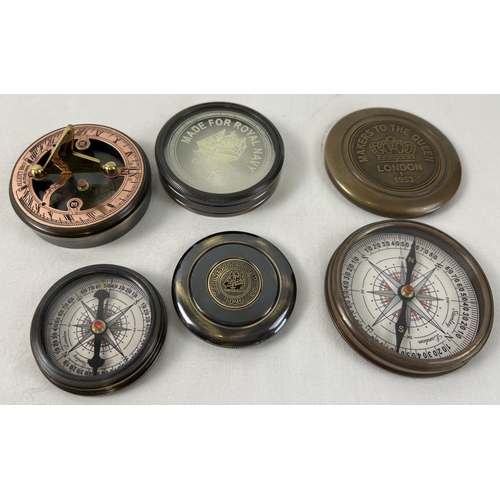 1318 - 3 metal cased naval compasses. A large brass cased compass with screw top lid (approx. 8cm diameter)... 