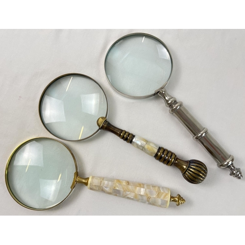 1319 - 3 large magnifying glasses to include brass handled set with pearl, and silver tone with turned desi... 