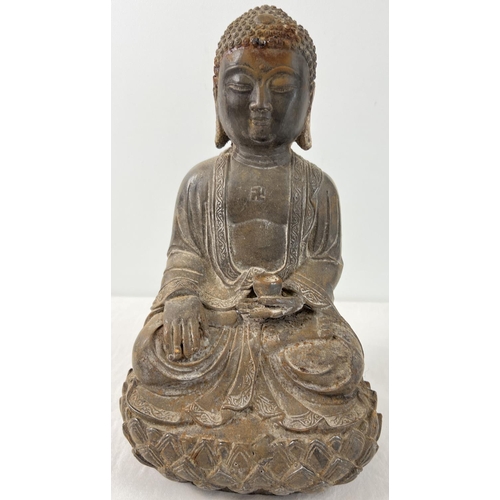 1271 - A Chinese hollow metal figure of Buddha sitting on a lotus flower. Approx. 33cm tall and weighs appr... 