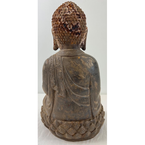 1271 - A Chinese hollow metal figure of Buddha sitting on a lotus flower. Approx. 33cm tall and weighs appr... 