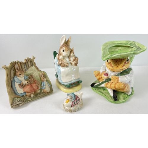 1223 - 4 ceramic and resin Beatrix Potter collectables. A large ceramic Jeremy Fisher jug and Mrs Rabbit mo... 