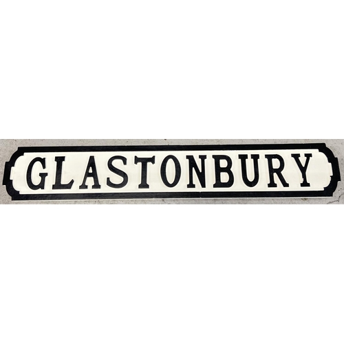 1323 - A modern painted wood sign for Glastonbury, in the style of an old street sign. Approx. 83cm long.