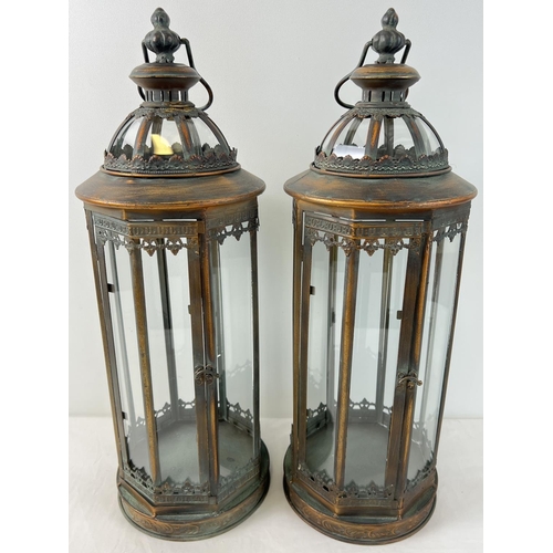 1327 - A pair of large slim circular shaped metal and glass panelled lanterns with hinged doors. 8 tall gla... 