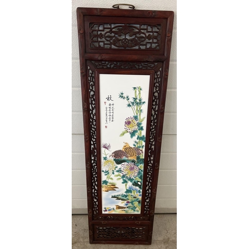 1272 - A large wooden framed ceramic Chinese panel depicting birds and flowers. Frame has decorative pierce... 