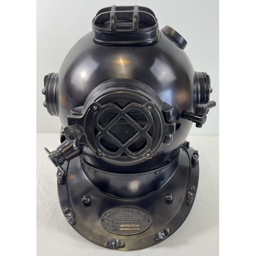 1331 - A full sized replica brown coloured metal mark V US Navy divers helmet. With glass panels and hinged... 