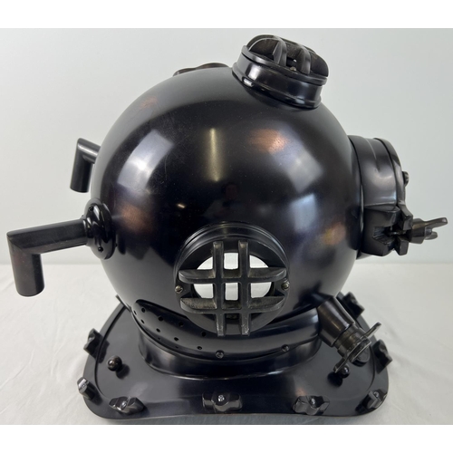 1331 - A full sized replica brown coloured metal mark V US Navy divers helmet. With glass panels and hinged... 