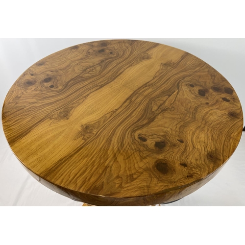 1428 - An Art Deco design circular shaped walnut veneer occasional table. With natural wood finish to top a... 