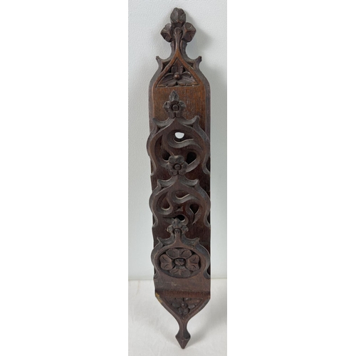 1334 - An early 20th century oak wall hanging letter rack with carved foliate decoration. Approx. 43cm long... 