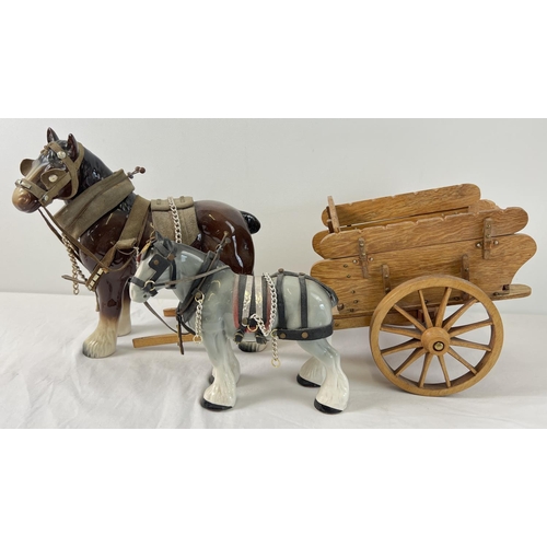 1225 - A large brown shire horse together with a smaller grey shire horse and a handmade wooden haycart. Wo... 