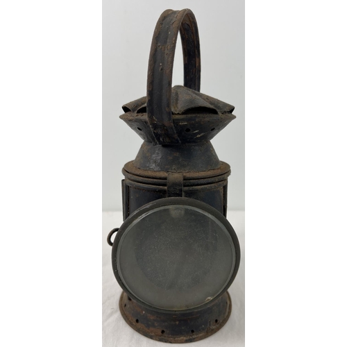 1151 - A 1943 black painted railway lamp with clear glass front and Sherwood's ceramic wick holder. Marked ... 