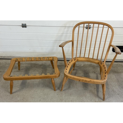 1434 - A mid century Ercol blonde low armchair and matching footstool frame. Upholstered cushions missing a... 