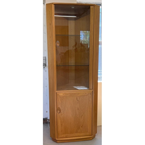 1435 - An Ercol Windsor blonde 2 door corner unit with glazed upper door and 2 interior glass shelves. Comp... 