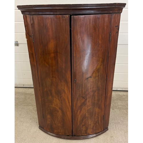 1439 - A Georgian mahogany curve fronted corner cupboard with 3 interior fixed shelves. Approx. 110cm tall ... 