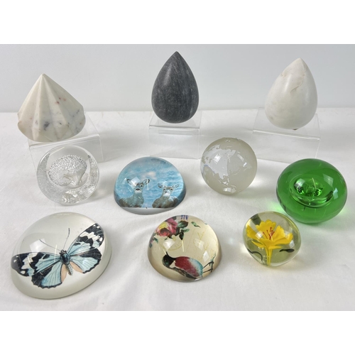 1256 - A collection of glass and marble paperweights. To include a Hedgehog lead crystal Swedish paperweigh... 