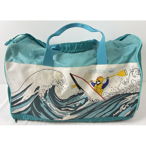 1366 - A vintage Adidas 'Canoe Island Crew' nylon holdall. Turquoise and teal colours with canoe and wave d... 