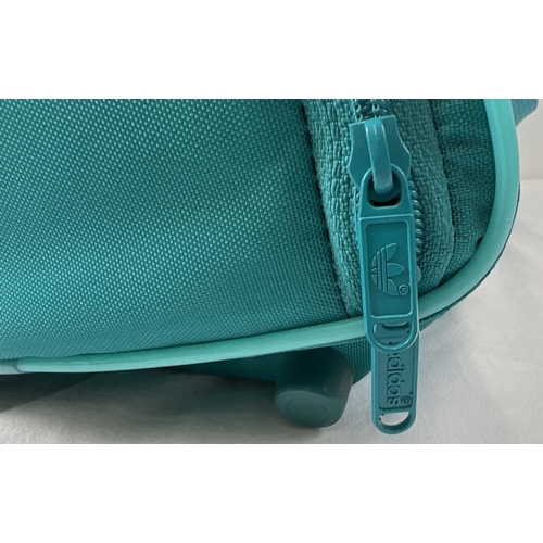 1366 - A vintage Adidas 'Canoe Island Crew' nylon holdall. Turquoise and teal colours with canoe and wave d... 