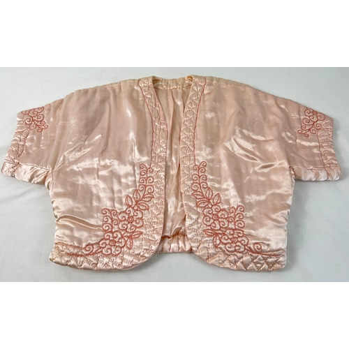 1367 - A vintage pink satin quilted bed jacket with embroidered detail.