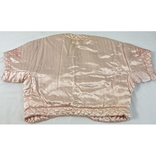 1367 - A vintage pink satin quilted bed jacket with embroidered detail.