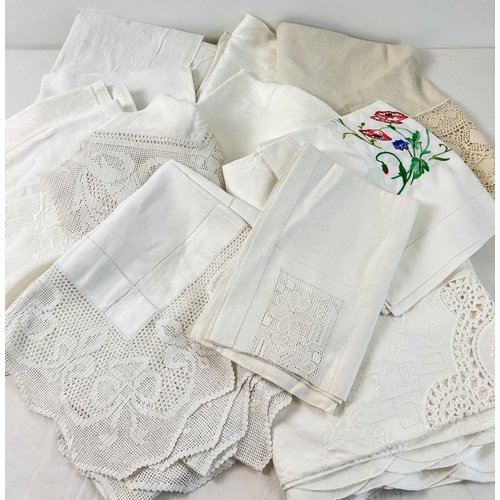 1340 - A quantity of vintage and antique table cloths and table linen. To include lace trimmed and embroide... 